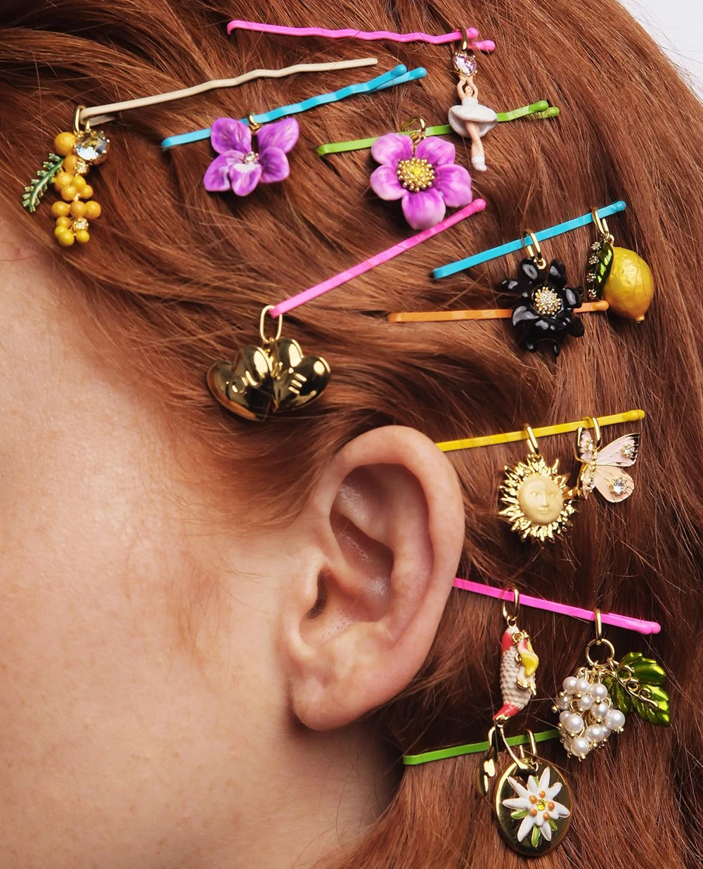 Product image of hair styled with plenty of colorful Miny hair clips and accessories, such as flowers, fruits, and hearts